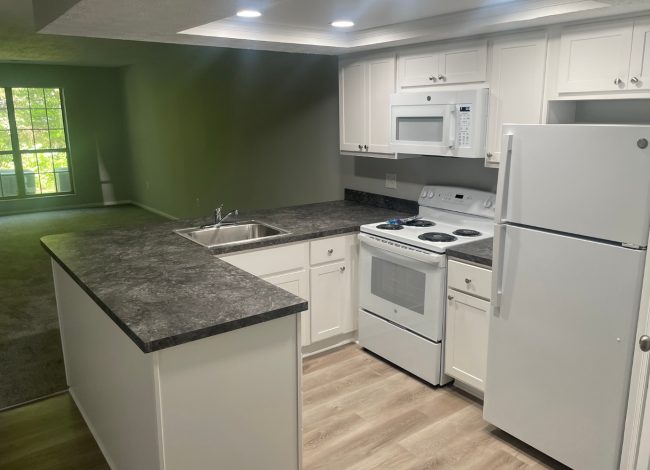 Hideaway Apartments green accent kitchen